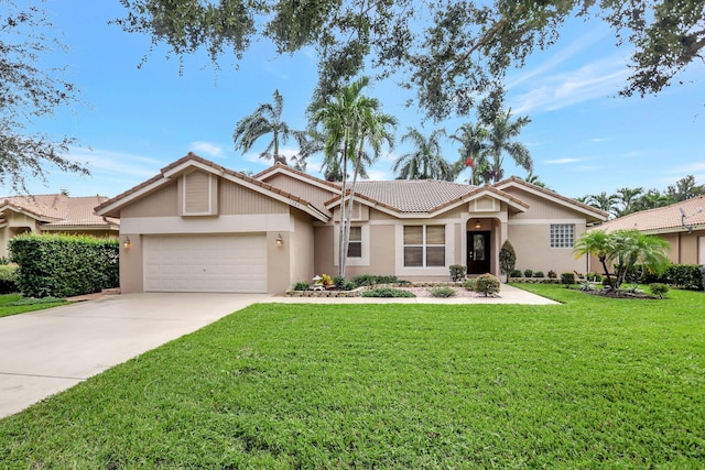 ranch-style house featuring a garage and a front yard