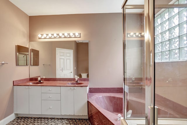 bathroom featuring vanity, tile patterned floors, and separate shower and tub