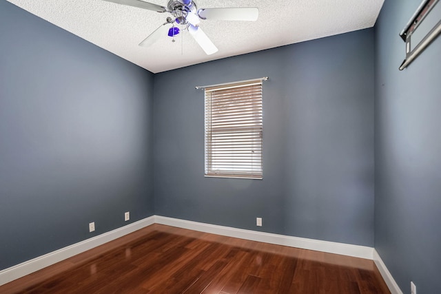 empty room with hardwood / wood-style flooring, ceiling fan, and a textured ceiling