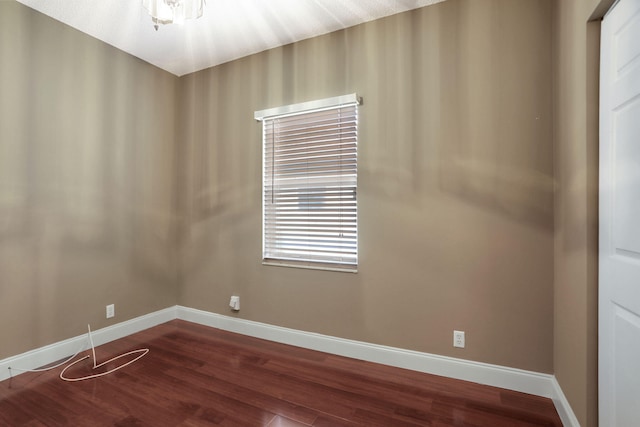 empty room with hardwood / wood-style floors