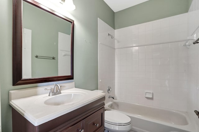 full bathroom featuring vanity, toilet, and tiled shower / bath