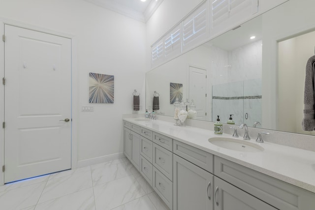 bathroom featuring vanity, an enclosed shower, and ornamental molding