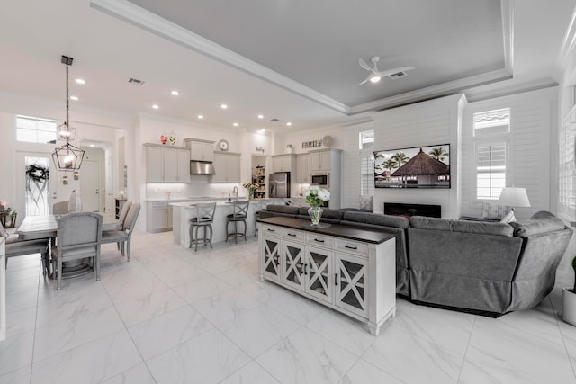 living room featuring a fireplace and ornamental molding