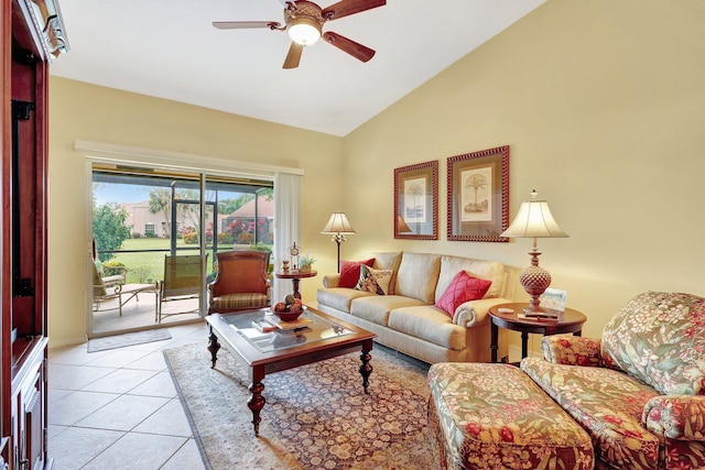 tiled living room featuring ceiling fan and high vaulted ceiling