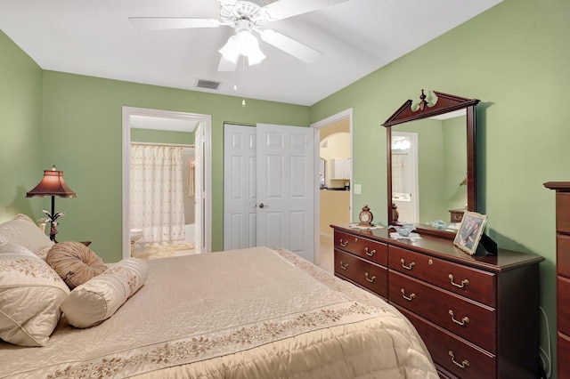 bedroom with ceiling fan, a closet, and ensuite bathroom