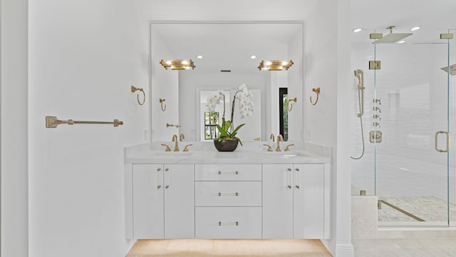 bathroom with an enclosed shower and vanity