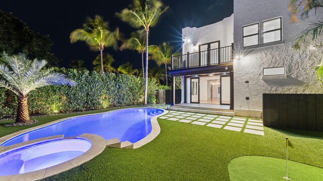 view of pool with a patio and an in ground hot tub