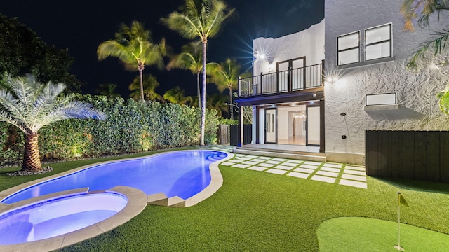 view of pool featuring an in ground hot tub and a patio