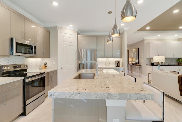 kitchen featuring gray cabinetry, backsplash, crown molding, hanging light fixtures, and stainless steel appliances