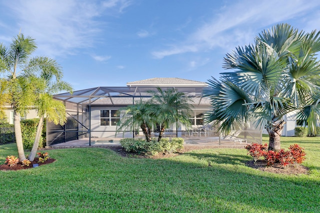 exterior space with a lawn and a lanai