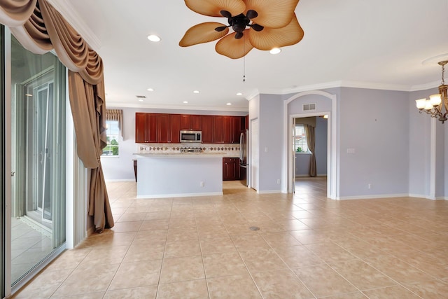 kitchen with stainless steel appliances, crown molding, decorative light fixtures, decorative backsplash, and light tile patterned floors