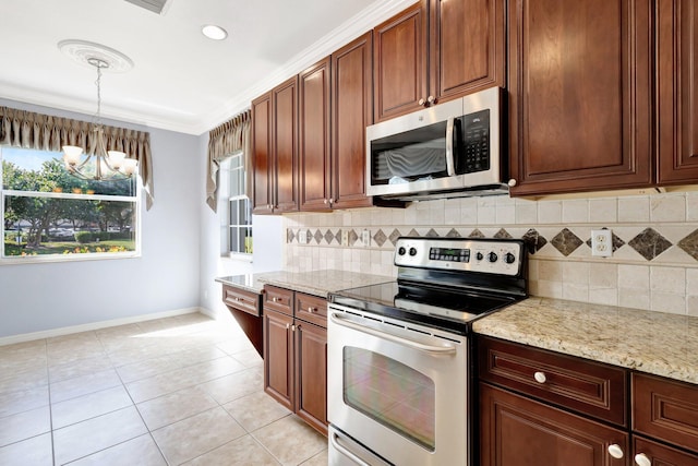 kitchen featuring pendant lighting, ornamental molding, stainless steel appliances, and tasteful backsplash