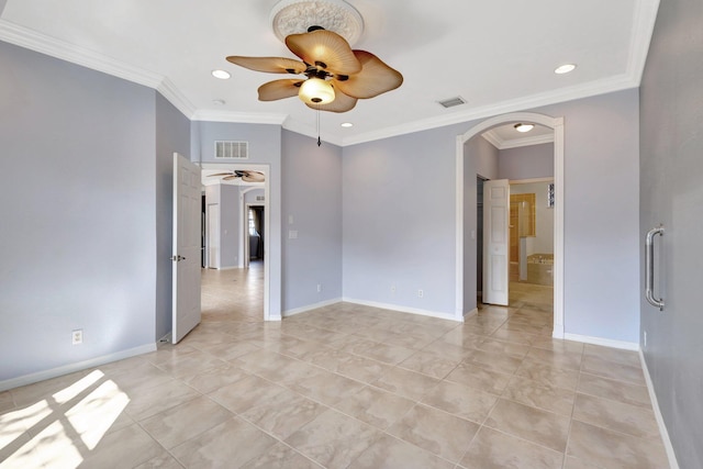 spare room with ceiling fan and crown molding