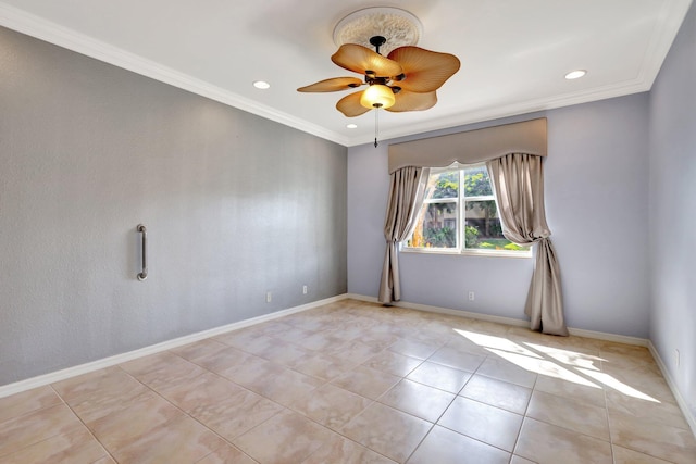 spare room featuring ceiling fan and crown molding