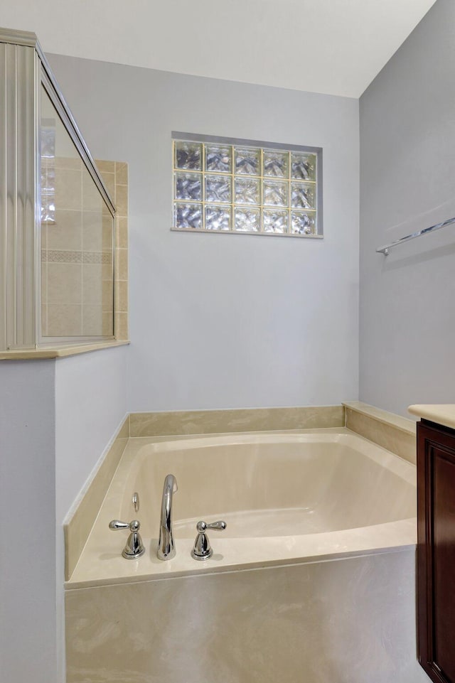 bathroom featuring vanity and a bathtub