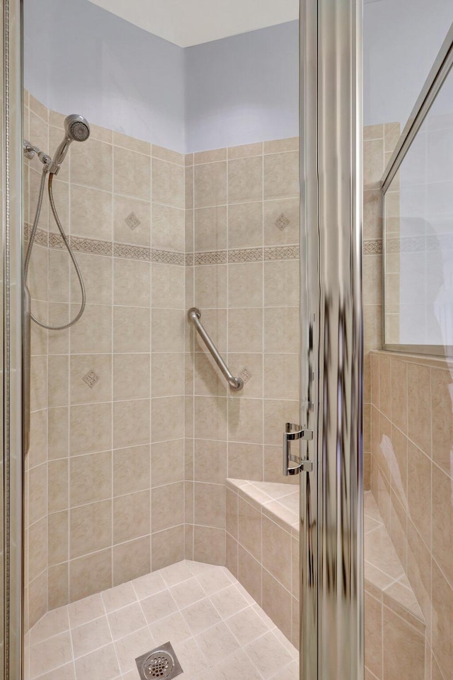 bathroom with tiled shower