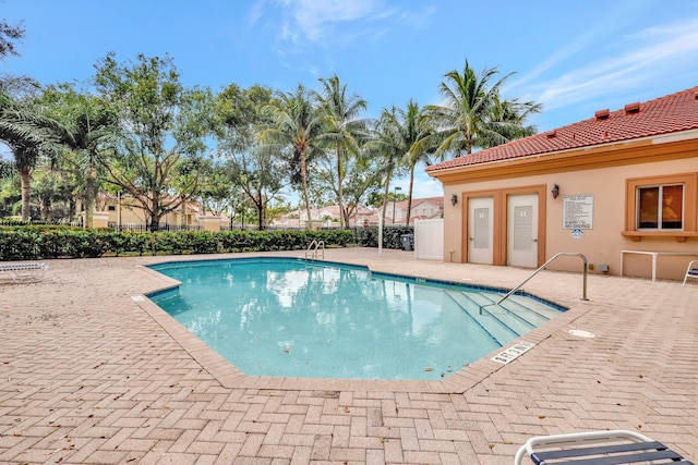 view of swimming pool with a patio area