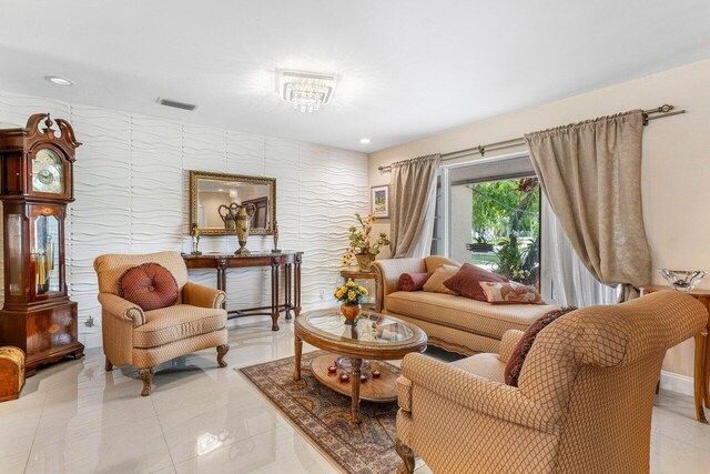 living room with baseboards, arched walkways, and recessed lighting