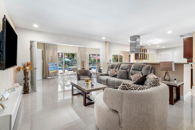 living room with visible vents and baseboards