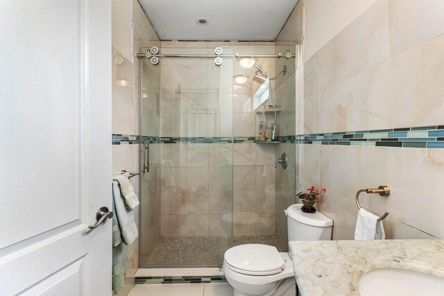 laundry area featuring laundry area, light tile patterned flooring, and a toaster