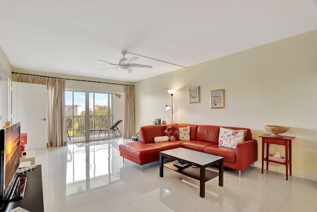 living room with ceiling fan and light tile patterned floors