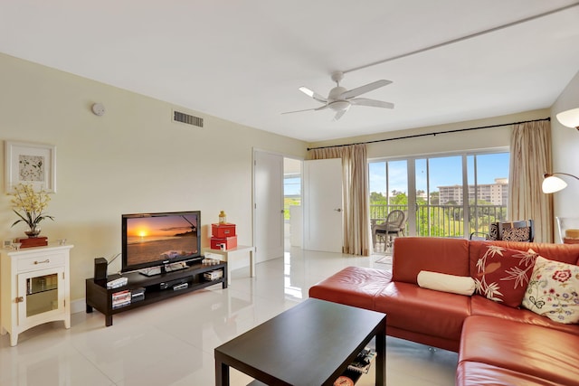 living room featuring ceiling fan and light tile patterned floors