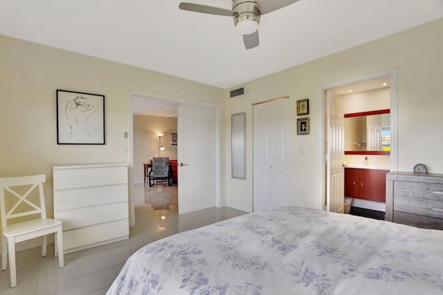 tiled bedroom with connected bathroom and ceiling fan