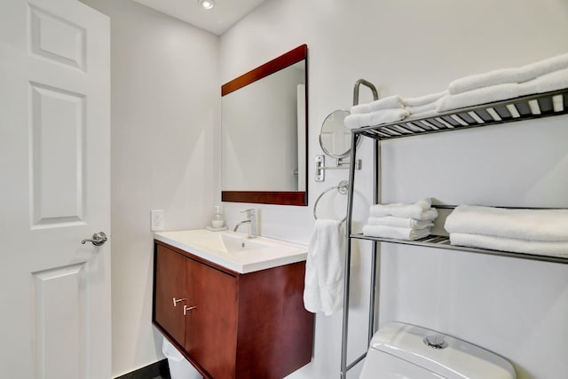 bathroom with vanity and toilet