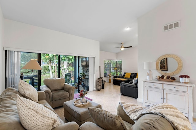 living room featuring ceiling fan, plenty of natural light, and light tile patterned flooring