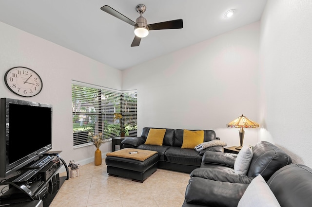 living room with light tile patterned floors, vaulted ceiling, and ceiling fan