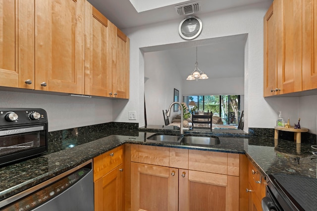 kitchen with stainless steel dishwasher, a notable chandelier, sink, and dark stone counters