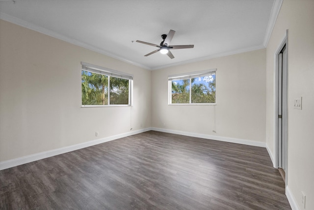 spare room featuring ceiling fan, dark hardwood / wood-style flooring, and crown molding