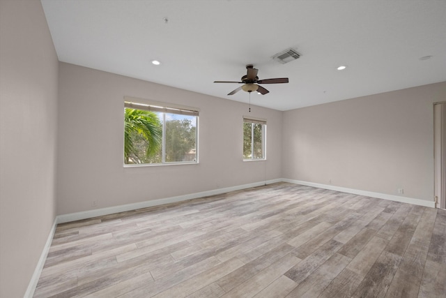 unfurnished room with light hardwood / wood-style floors and ceiling fan