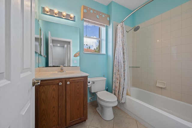 full bathroom featuring toilet, vanity, tile patterned floors, and shower / tub combo with curtain