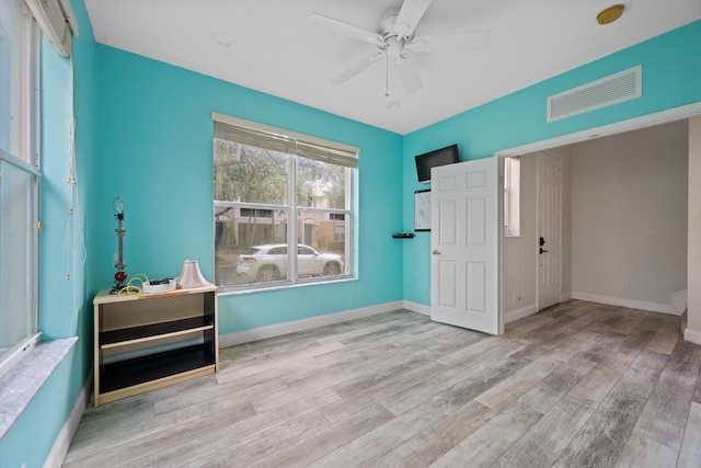 unfurnished bedroom featuring ceiling fan and light hardwood / wood-style flooring