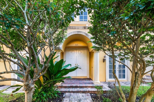 property entrance featuring french doors