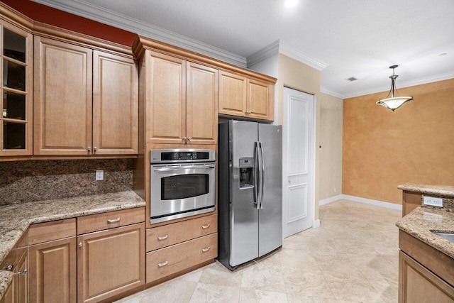 kitchen featuring light stone countertops, appliances with stainless steel finishes, decorative light fixtures, and crown molding