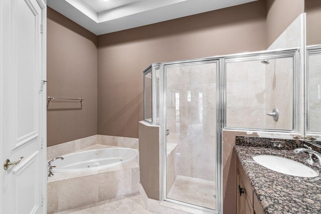 bathroom featuring vanity, shower with separate bathtub, and tile patterned floors