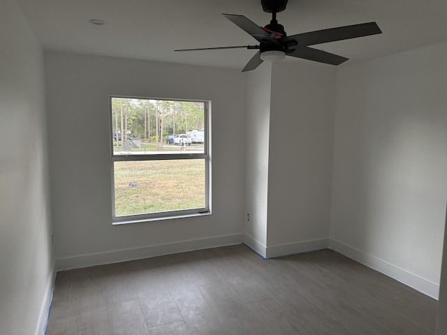 empty room featuring ceiling fan and wood-type flooring