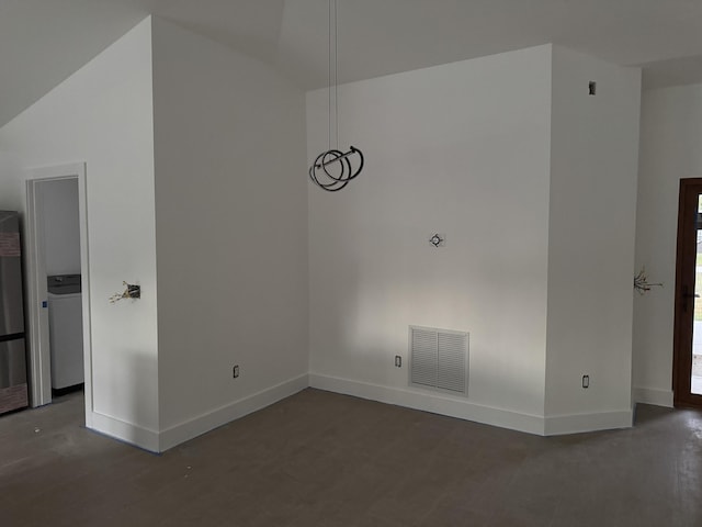 unfurnished room with dark wood-type flooring and washer / clothes dryer