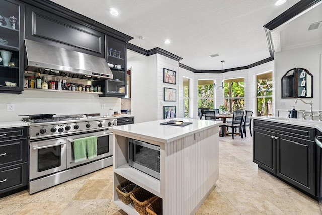 kitchen featuring sink, a textured ceiling, appliances with stainless steel finishes, exhaust hood, and ornamental molding