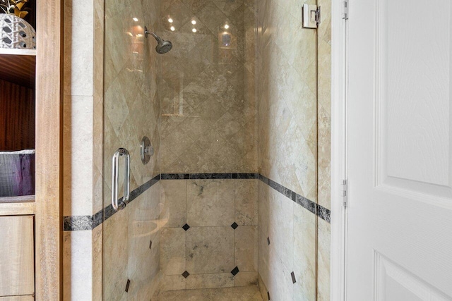 bathroom featuring a shower with door