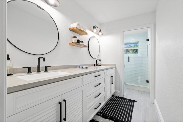 bathroom featuring vanity and walk in shower