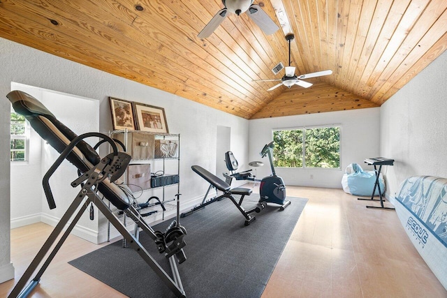 workout area featuring ceiling fan, wood ceiling, and vaulted ceiling