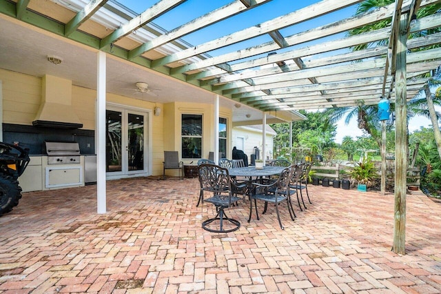 view of patio / terrace with a pergola, grilling area, and french doors