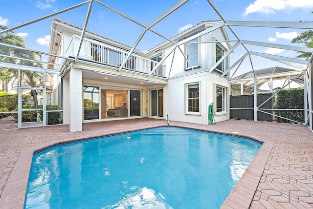 view of pool with a lanai and a patio