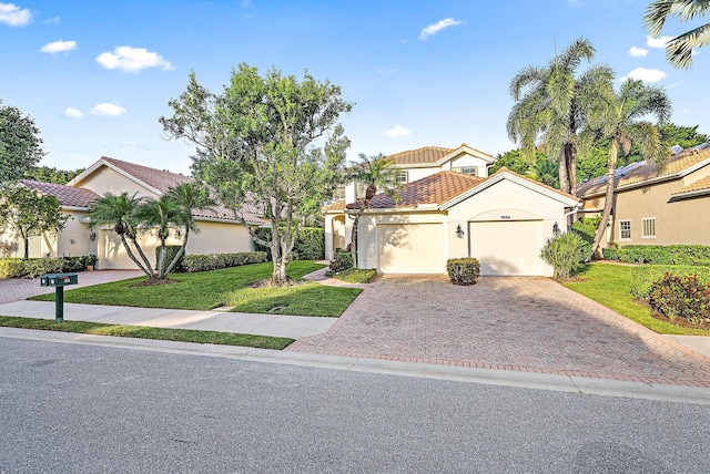 mediterranean / spanish-style home featuring a front yard