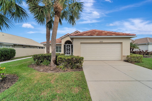 view of front of house with a garage and a front yard