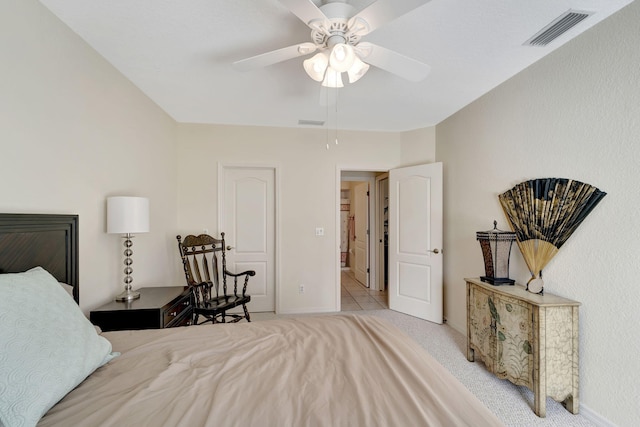 bedroom featuring ceiling fan and light colored carpet