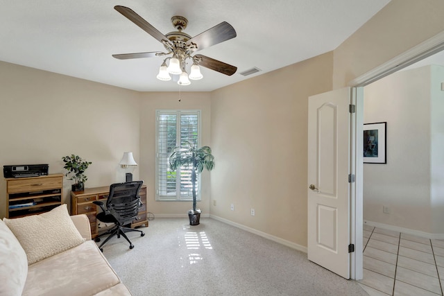 carpeted home office with ceiling fan